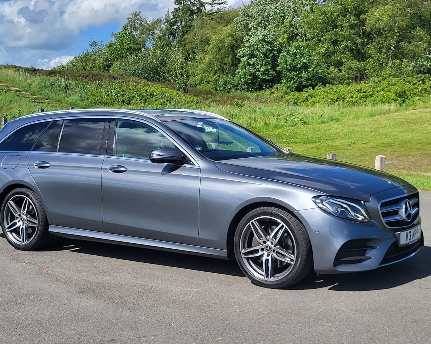 The Top Marks Airport Services Mercedes-Benz E-Class Estate, side profile on a country lane