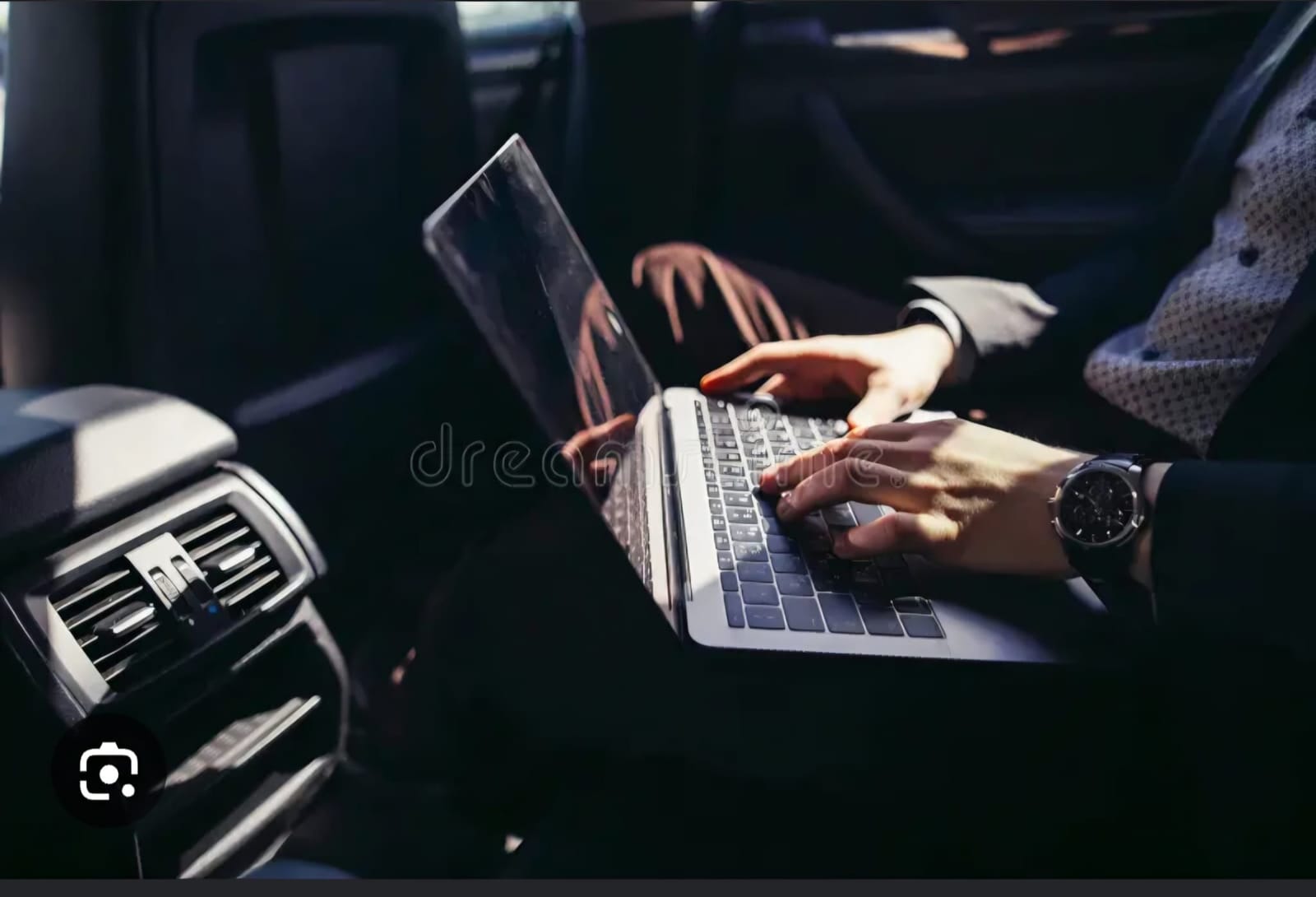Business passenger working on a laptop while travelling